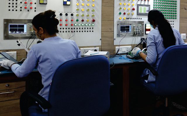 Technicians testing control boards